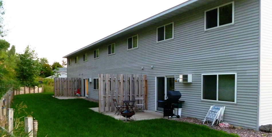 private backyard with deck in 3 bedroom apartment rental in menomonie wi